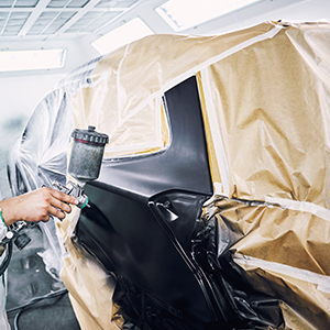 a car taped off for painting